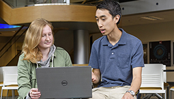 Evan Wang with other student in the Lawson Computer Science buidling.