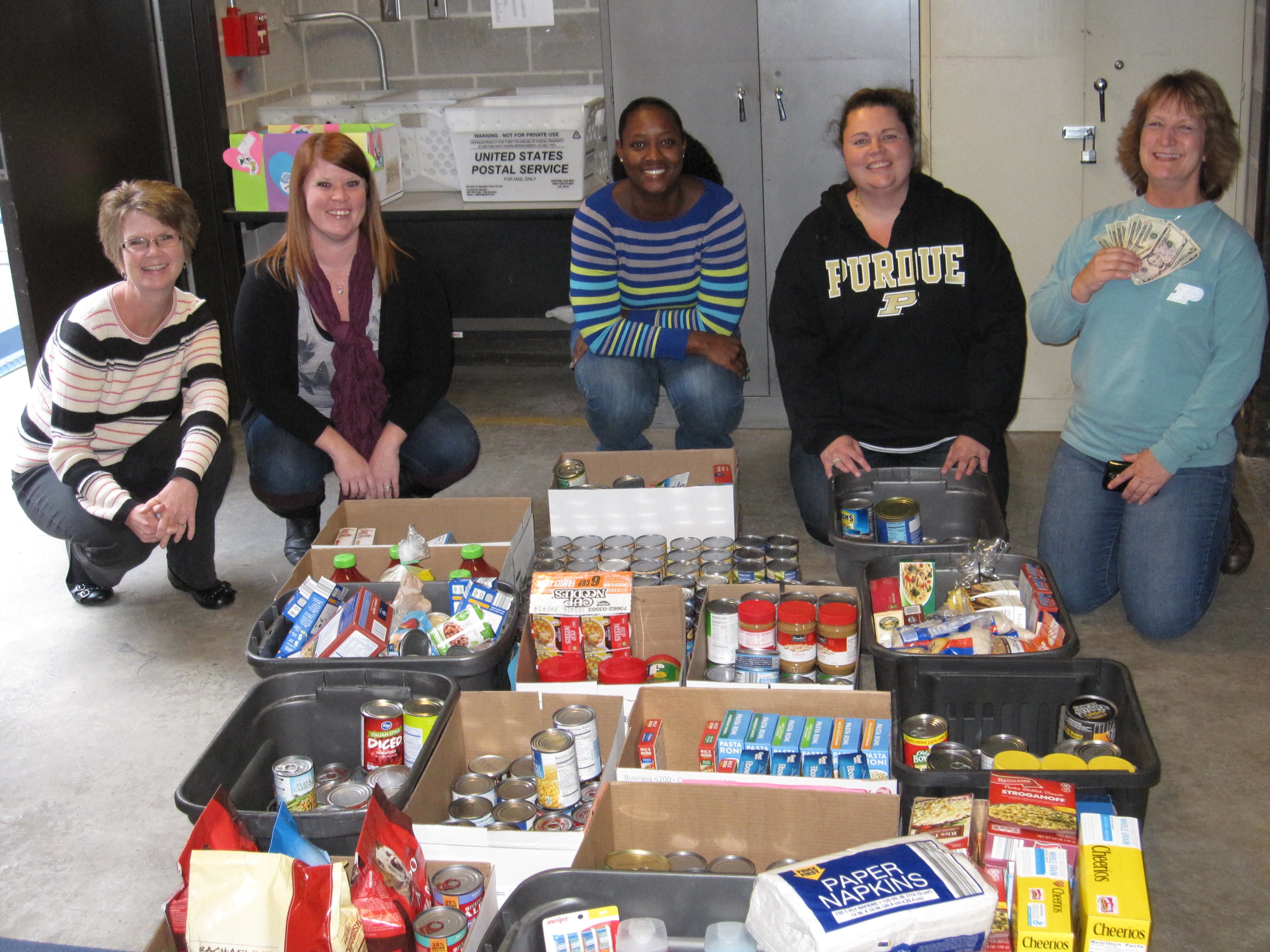 Some of the staff gathered for a photo and to load the food