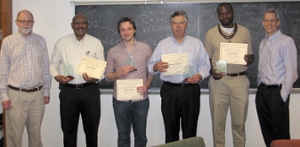 Associate Head Prof. Jim McClure (far left) and Department Head Prof. Gregery Buzzard (far right) present Spira awards to Prof. Johnny Brown, Prof. Daniel Kelleher, Prof. Rodrigo BaƱuelos and Prof. Edinah Gnang for excellence in teaching and mentoring.