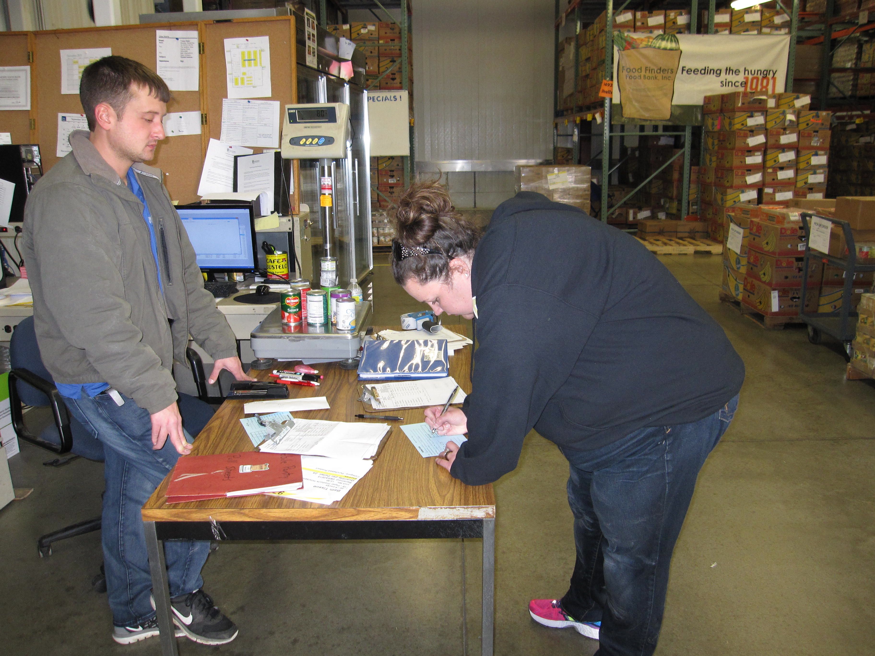 Rebecca Lank delivering over 500 pounds of food to the food bank on behalf of the Department of Mathematics