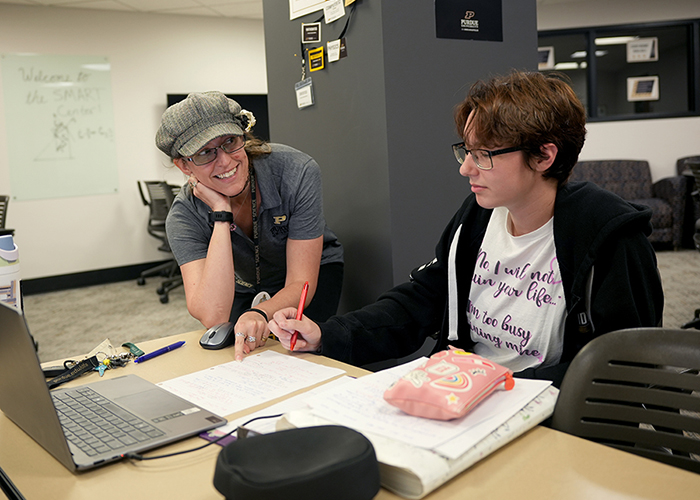 Julie Lang, director of the SMART Center, works with student Dani Hatt