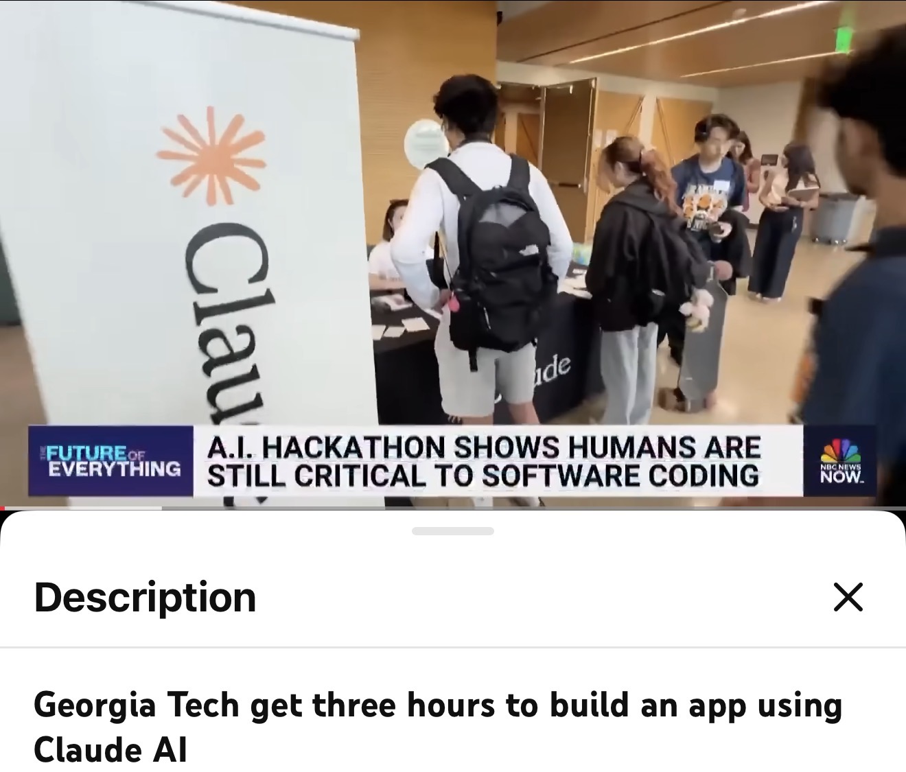Screenshot of an NBC News Now segment titled The Future of Everything. Students carrying backpacks gather around a table beneath a tall banner reading Claude. The on-screen headline reads: A.I. hackathon shows humans are still critical to software coding. A description panel below reads: Georgia Tech get three hours to build an app using Claude AI.